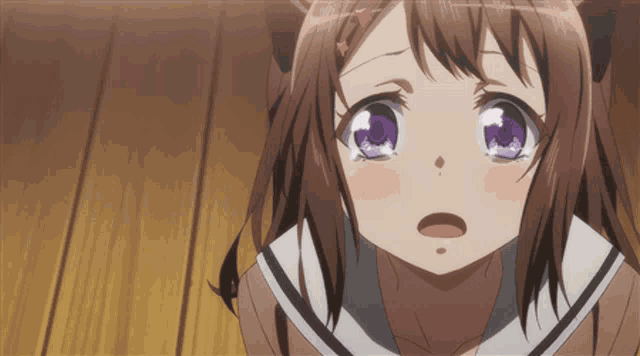 a girl with purple eyes is looking at the camera