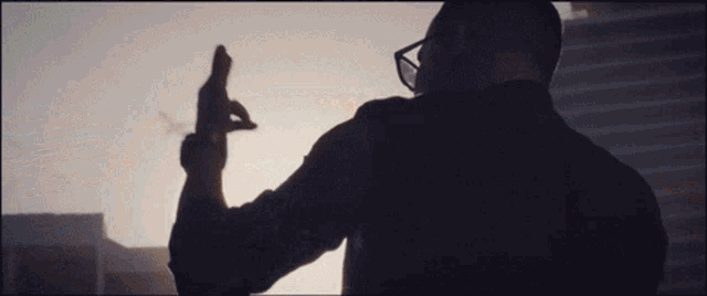 a man taking a picture with a cell phone