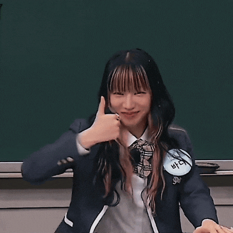 a girl in a school uniform with a name tag that says bae