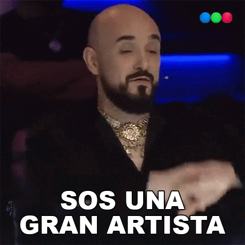 a bald man with a beard is saying sos una gran artista