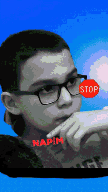 a boy wearing glasses and a stop sign on his face