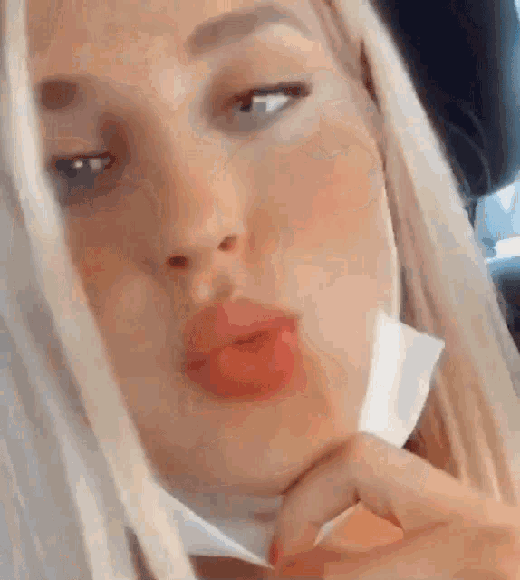 a close up of a woman wearing a face mask