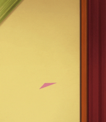 a yellow wall with a red curtain hanging on it