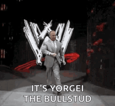 a man in a suit and tie is walking on a stage with the words `` it 's yorge ! ''