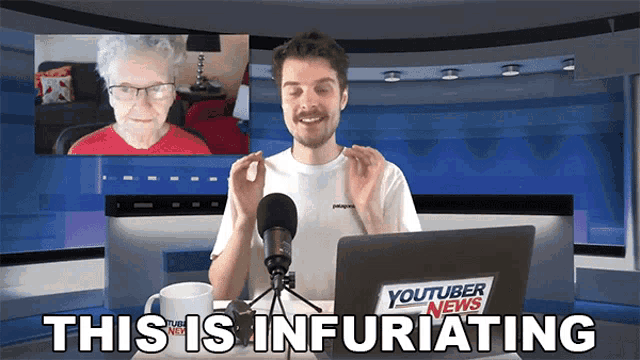 a man sitting in front of a laptop with a youtuber news sticker on his shirt