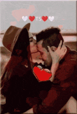 a man and a woman are kissing with the letters ts visible