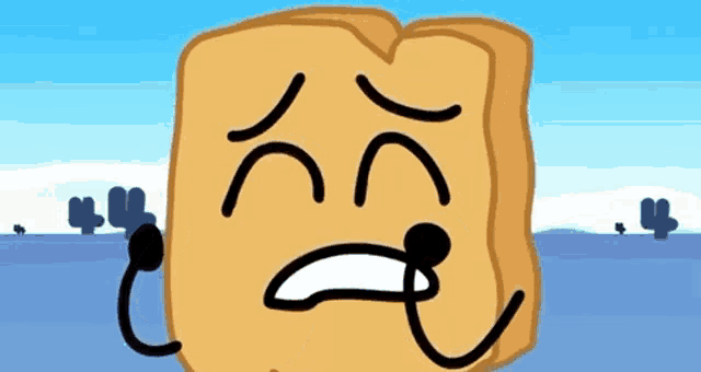 a wooden block with a sad face on it .