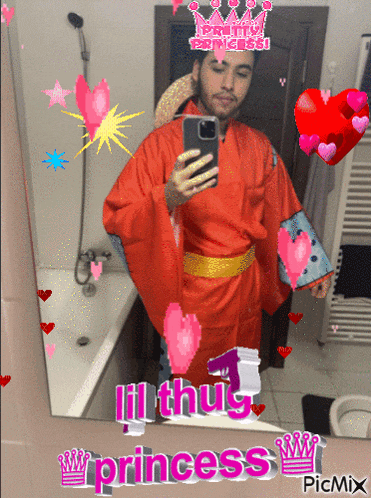 a man taking a picture of himself in front of a mirror with lil thug princess written in pink