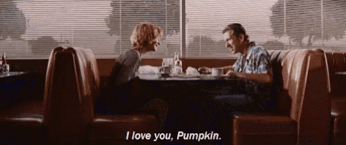 a man and a woman sit at a table in a diner and the man says i love you pumpkin