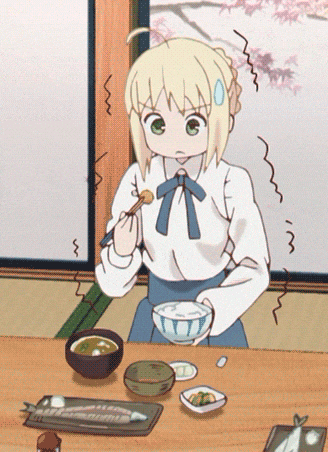 a girl sitting at a table with a bowl of food