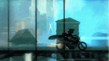 a silhouette of a person riding a motorcycle in front of a window that says ' avengers '