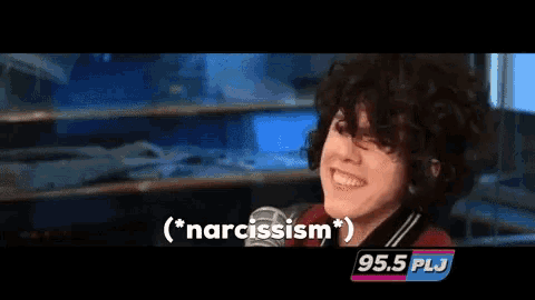 a woman talking into a microphone with the words narcissism written above her