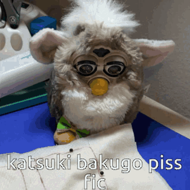 a stuffed animal with the words katsuki bakugo piss fic written below it