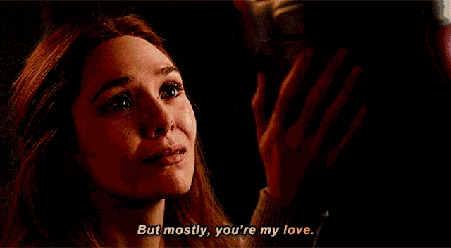 a woman says " but mostly you 're my love " in a dark room