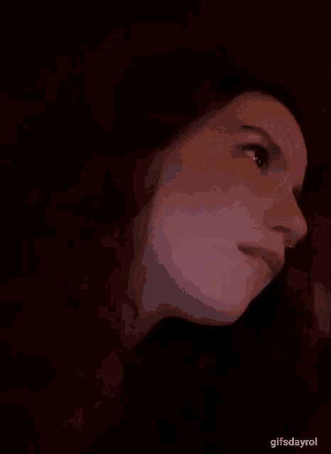 a close up of a woman 's face with the words gifsdayrol on the bottom
