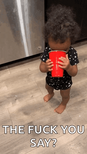 a baby drinking from a red cup with the words the fuck you say