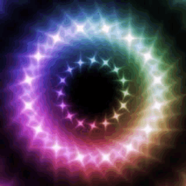 a rainbow colored swirl of stars on a dark background .