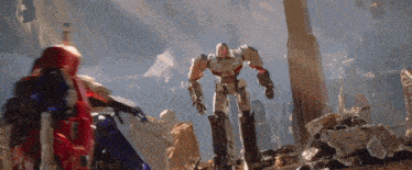 two robots are standing next to each other in a ruined area