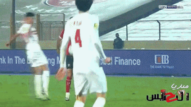 a soccer player with the number 4 on their jersey