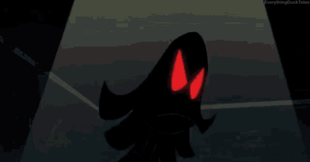 a cartoon character with red eyes is holding a red bubble