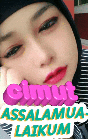 a woman wearing a hijab has a sticker on her face that says ' ciumut assalamua laikum '