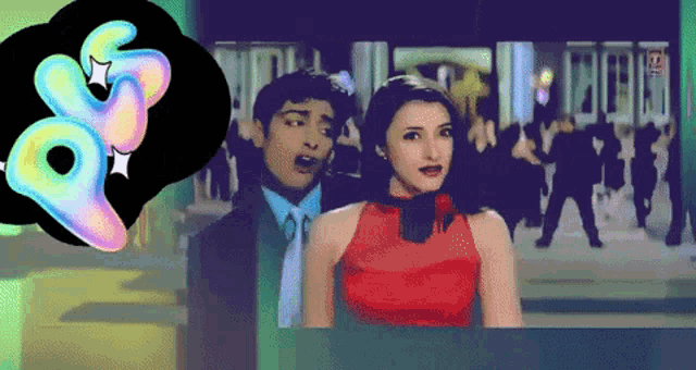 a woman in a red dress is standing next to a man in a suit and tie