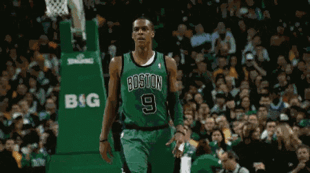 a boston basketball player wearing a green jersey with the number 9 on it