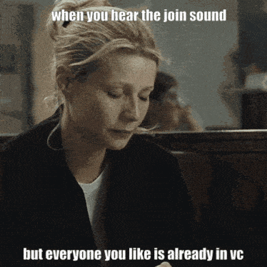 a woman is sitting at a table with a meme that says when you hear the join sound but everyone you like is already in vc