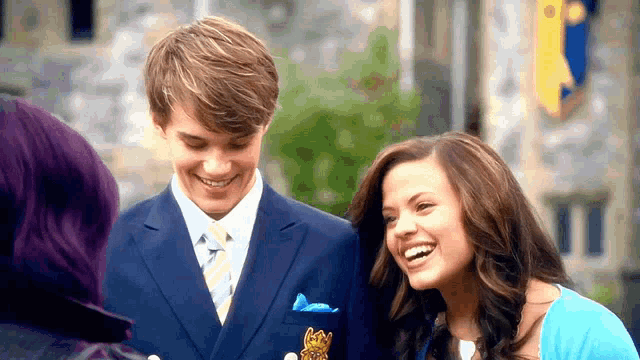 a man and a woman are smiling and laughing together