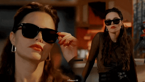 a woman wearing sunglasses and a black shirt has a watermark that says ' denmar99 ' at the bottom