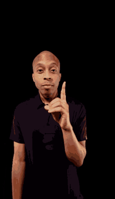 a man in a black shirt with the letter e on the front