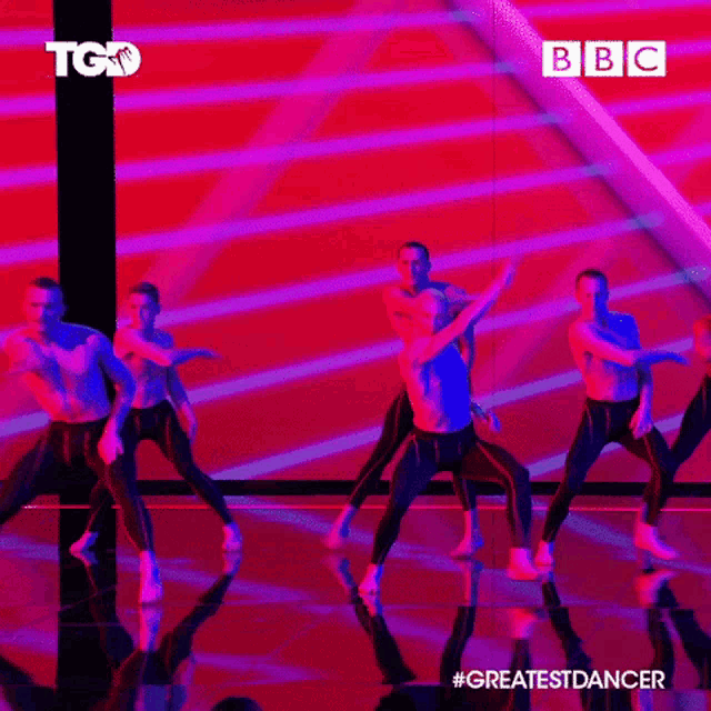 a group of dancers are performing on a stage with a bbc logo behind them