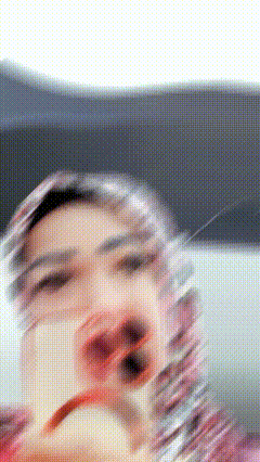 a blurry picture of a person 's face with a polka dot pattern