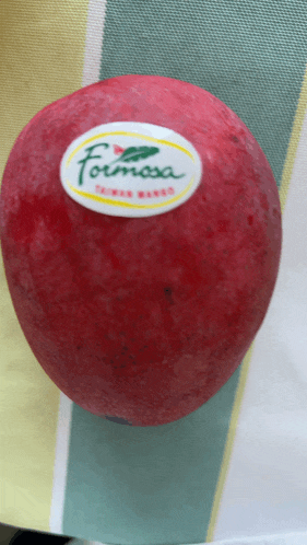 a red fruit with a label that says " formosa " on it