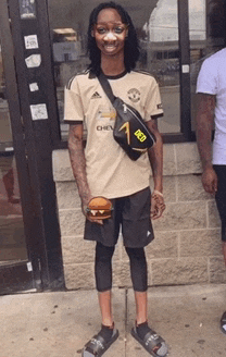 a man wearing a shirt that says chevy on it