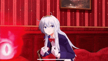 a girl with long white hair is sitting on a red couch in a room .
