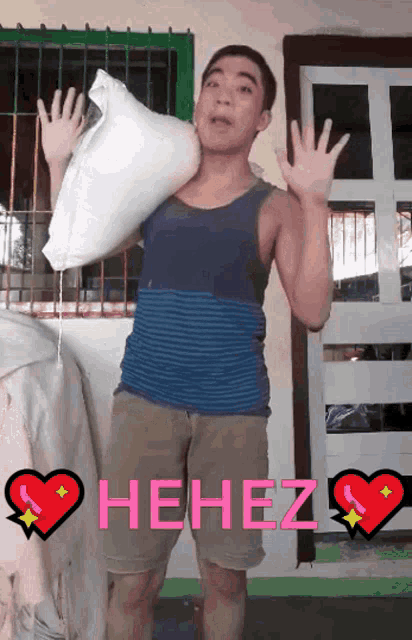 a man is holding a pillow over his shoulder and says " hehez " in pink