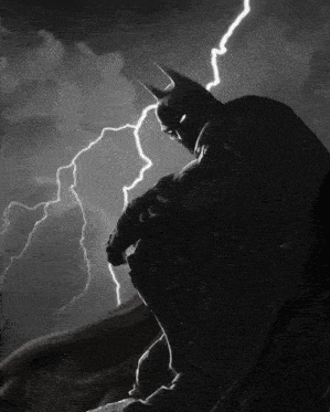 a black and white photo of batman in the rain with lightning behind him