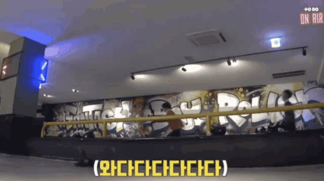 a room with graffiti on the wall and on air written on the ceiling