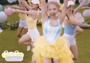 a group of women are dancing in a field with balloons in the background and the words pop labels on the bottom
