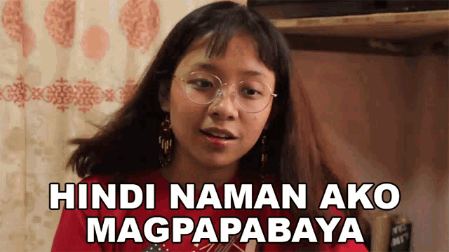 a girl with glasses and a red shirt says hindi naman ako magpapabaya