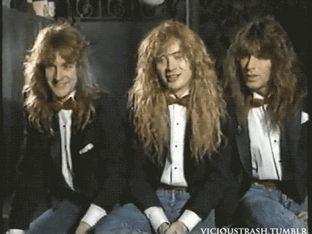 three men wearing tuxedos and bow ties are posing for a picture