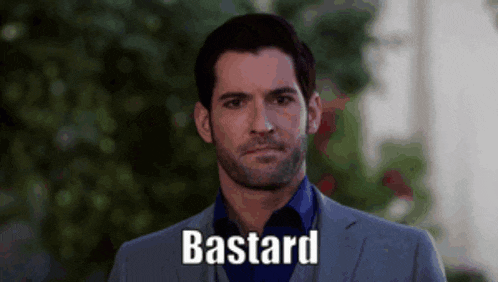 a man in a suit says bastard in front of a blurry background