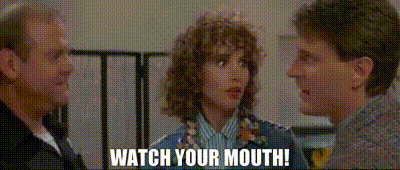 a man and two women are talking to each other with the words watch your mouth written on the screen .