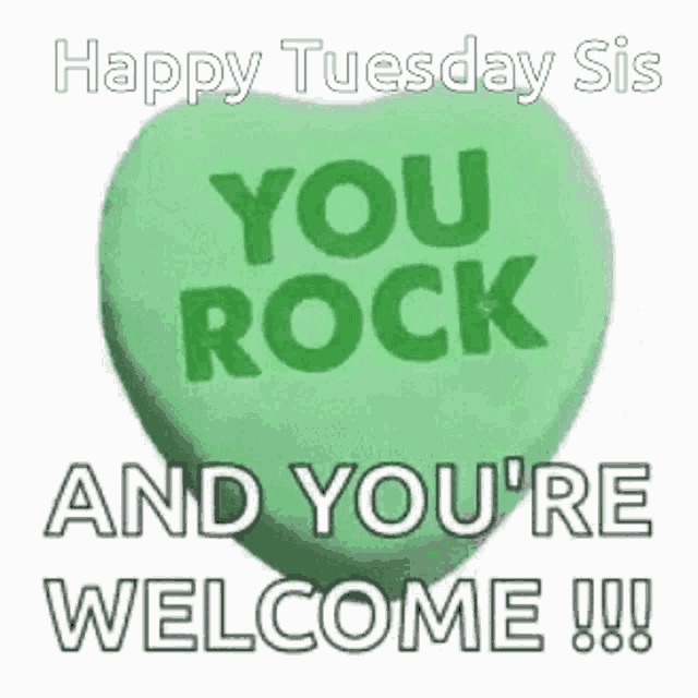 a green heart shaped candy with the words `` you rock and you 're welcome '' on it .