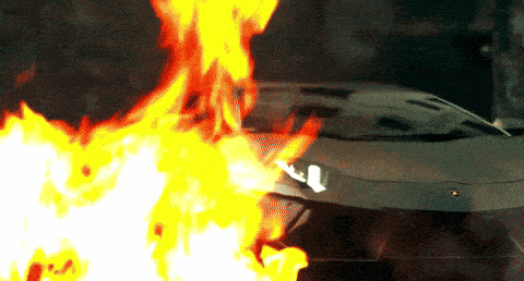 a car is on fire with the letter l on the front