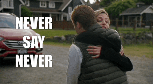 a man and woman hugging with the words " never say never " on the bottom