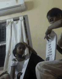 a woman is playing a keyboard in a room with a child
