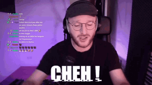 a man wearing headphones and glasses says cheh !