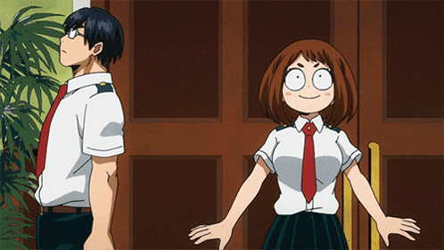 a man and a woman are standing next to each other in front of a door